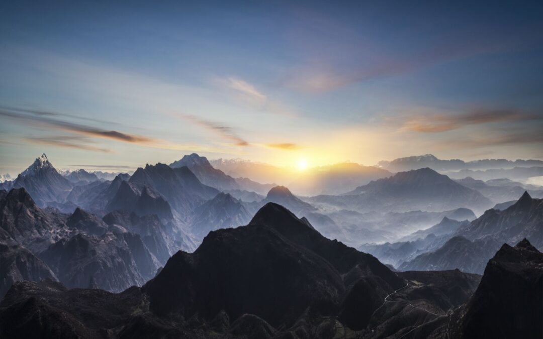 Aerial-view-of-misty-mountains-at-sunrise-1195458582_3954x2522