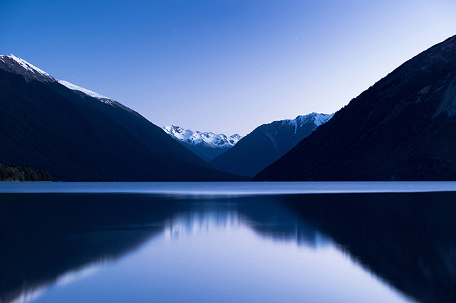 The stunning reflection of the alps mountain on the lake after sunset. St Arnaud, Nelson Lakes National Park.